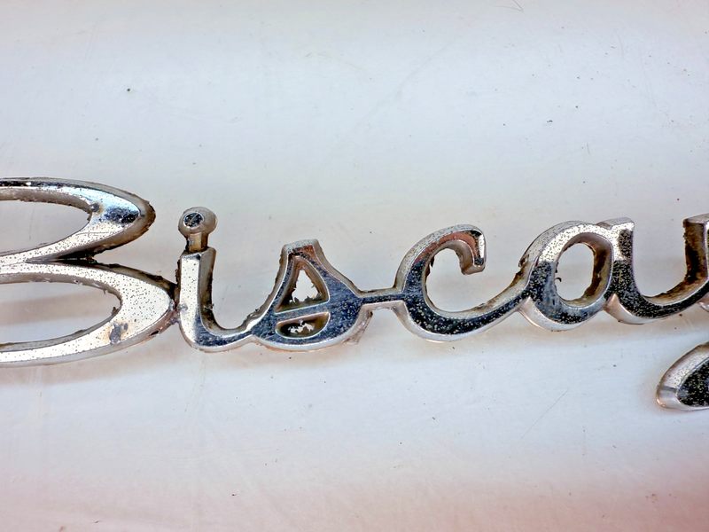 OEM 1964 CHEVROLET BISCAYNE CHROME QUARTER PANEL SCRIPT EMBLEM 4886814 E7-4