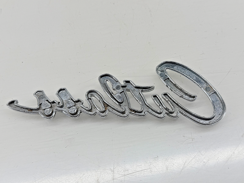 OEM 1968 Oldsmobile Cutlass Trunk Script Emblem Name Plate 7791576 E9-72