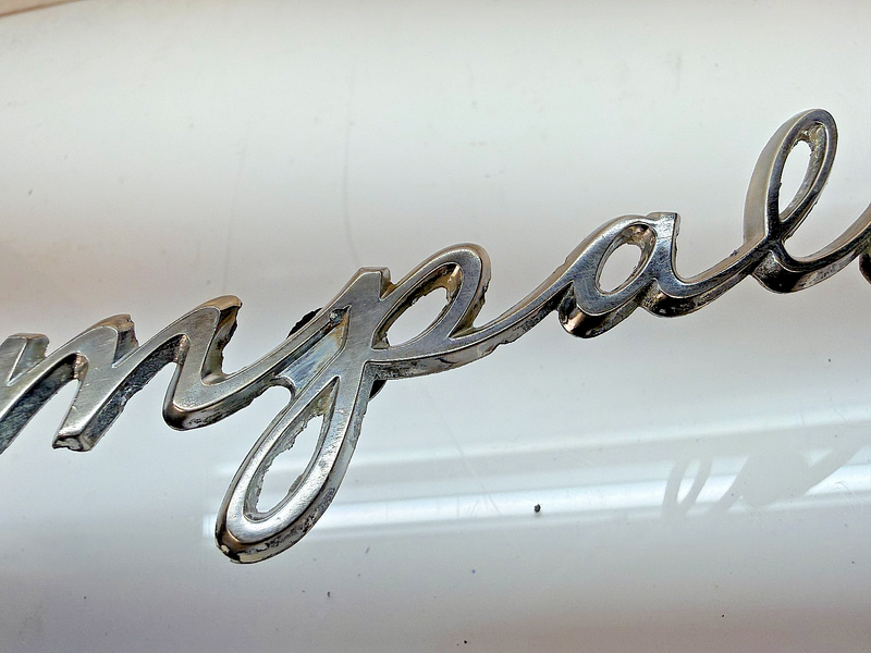 OEM 1961 1962 CHEVROLET IMPALA QUARTER PANEL NAMEPLATE SCRIPT EMBLEM E8-54