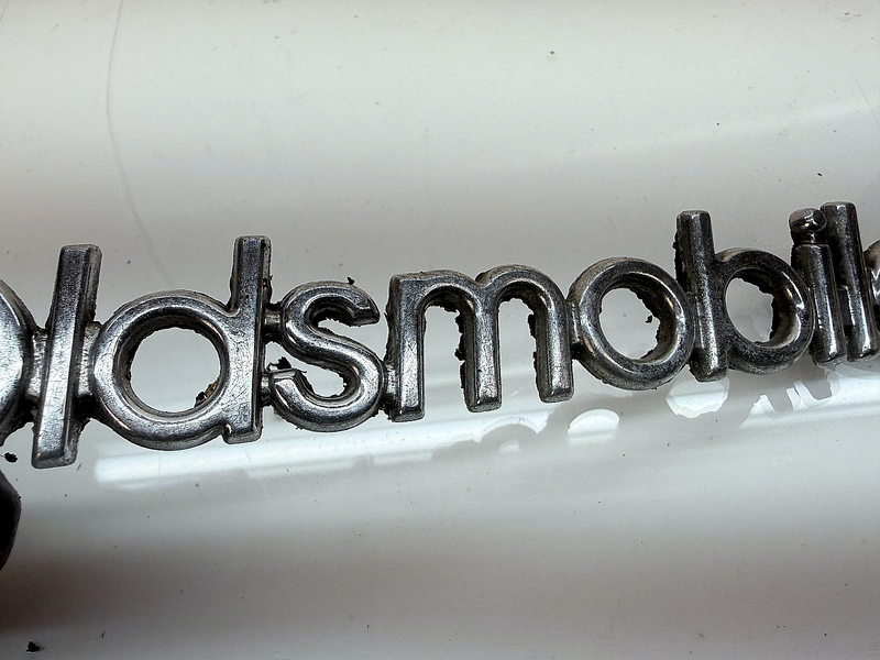 OEM 1987 1988 CUTLASS SUPREME 442 BROUGHAM HEADER PANEL SCRIPT Emblem E8-51