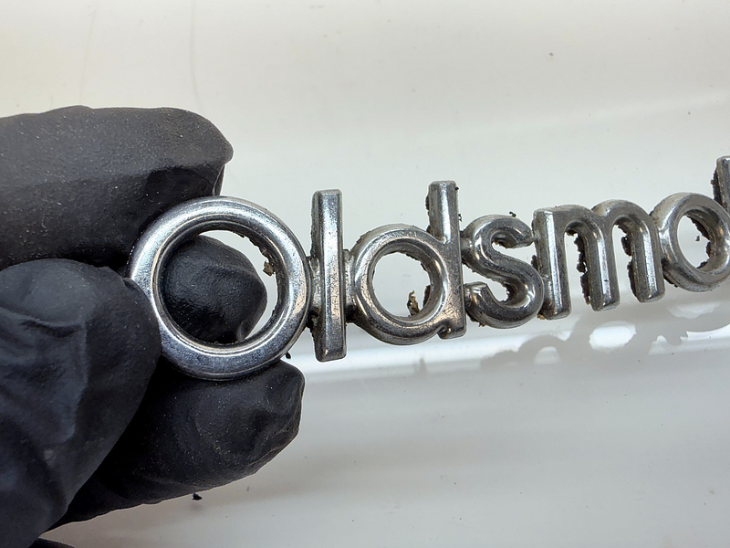 OEM 1987 1988 CUTLASS SUPREME 442 BROUGHAM HEADER PANEL SCRIPT Emblem E8-51