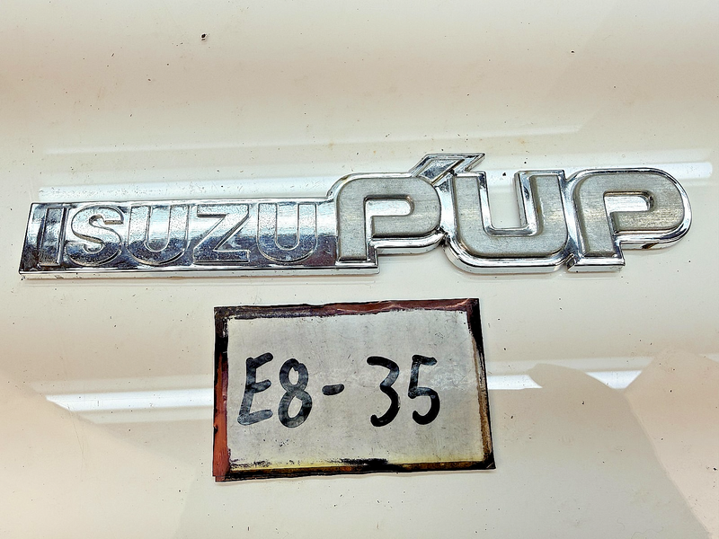 OEM 1983 - 1987 Isuzu Pup Pick Up Truck Fender Emblem E8-35
