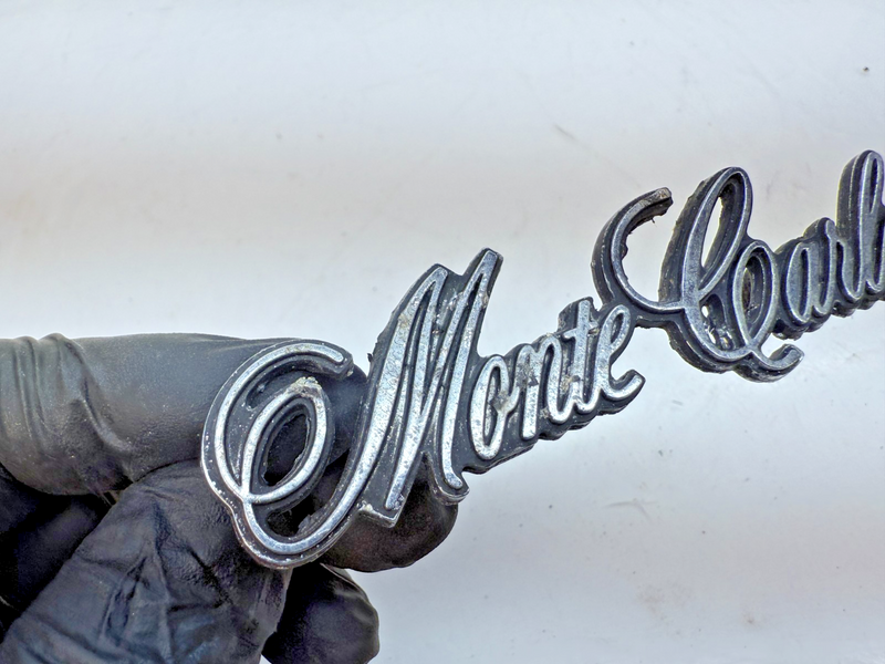OEM 1973 - 1977 Chevrolet Monte Carlo Header Panel Emblem 325272 E6-116