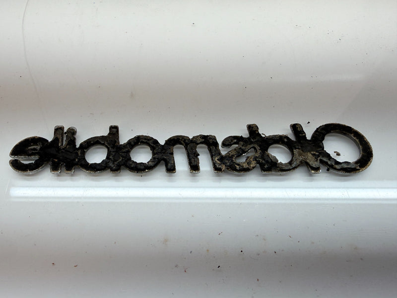 OEM 1987 1988 CUTLASS SUPREME 442 BROUGHAM HEADER PANEL SCRIPT Emblem E8-51