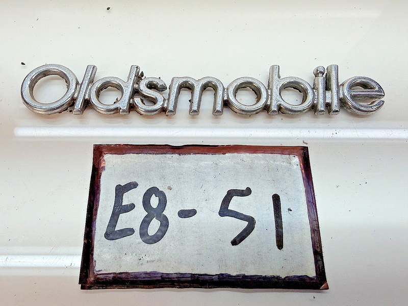 OEM 1987 1988 CUTLASS SUPREME 442 BROUGHAM HEADER PANEL SCRIPT Emblem E8-51