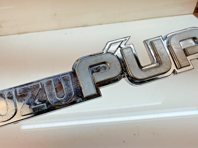 OEM 1983 - 1987 Isuzu Pup Pick Up Truck Fender Emblem E8-35