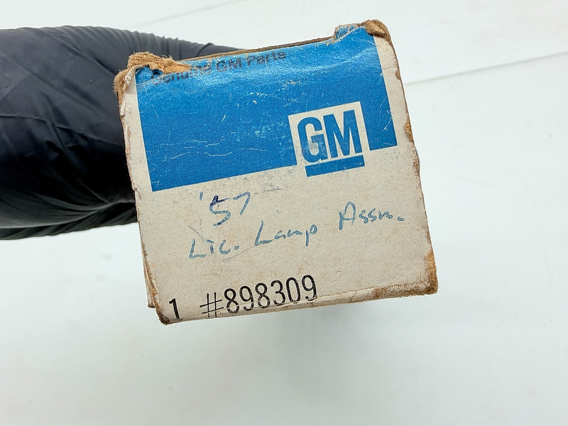 NOS 1957 Chevrolet BelAir 210 Rear License Plate Light Lamp 898309 C73-20