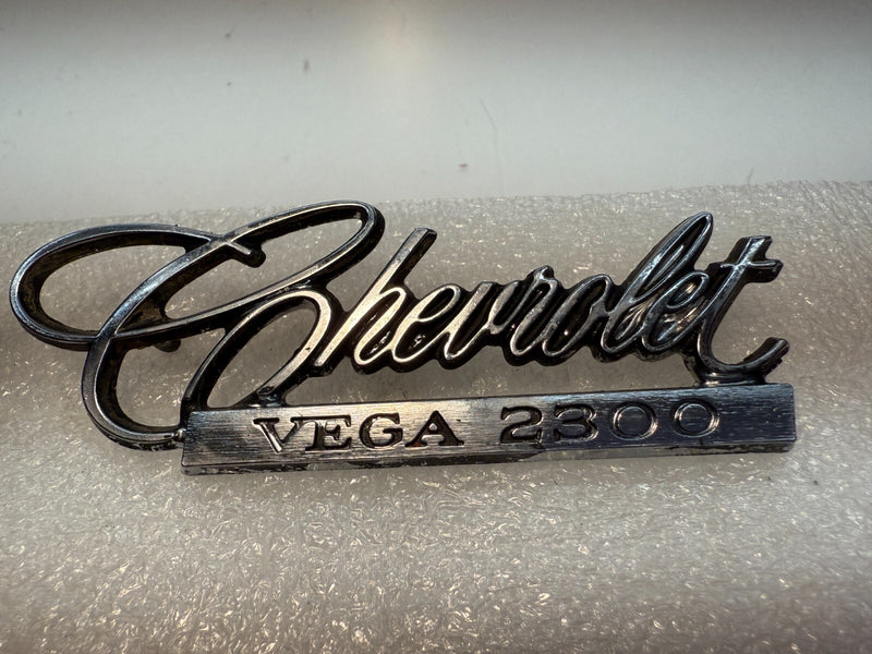 OEM 1971-75 Chevrolet Vega 2300 PAIR Emblem Nameplate Badge 9870383 B32-63