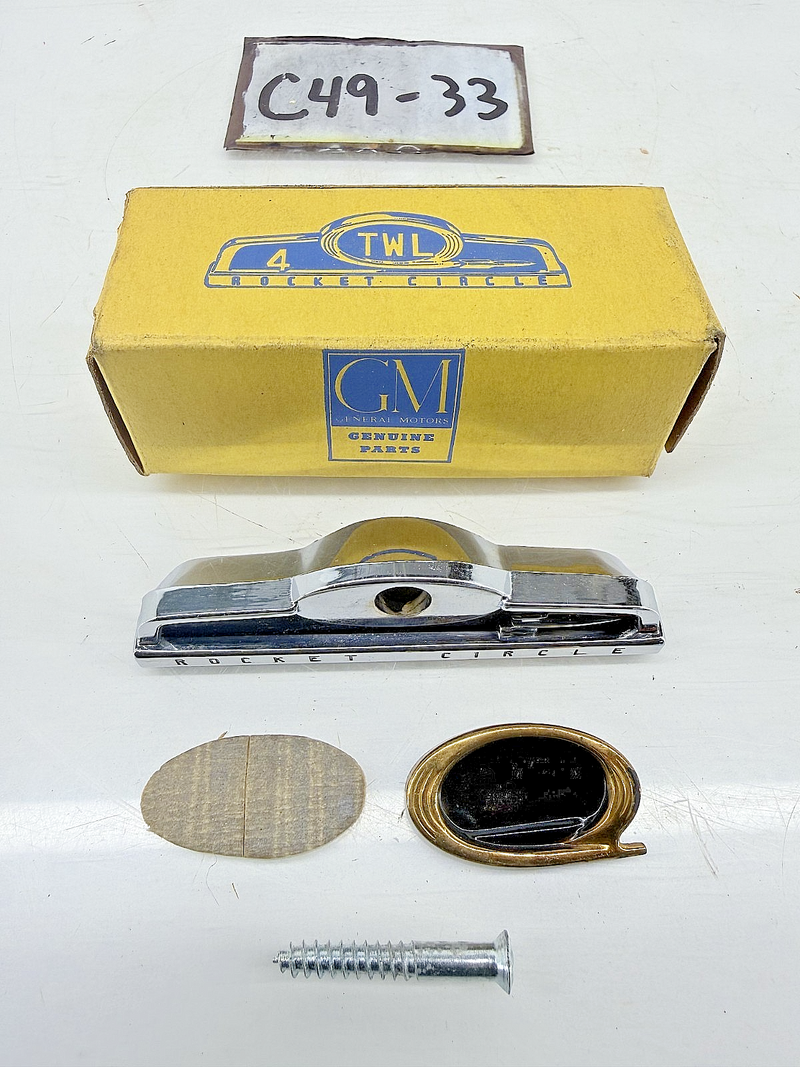 NOS OEM GM 1954 - 1957 Oldsmobile Rocket Circle Emblem 983421 C49-33