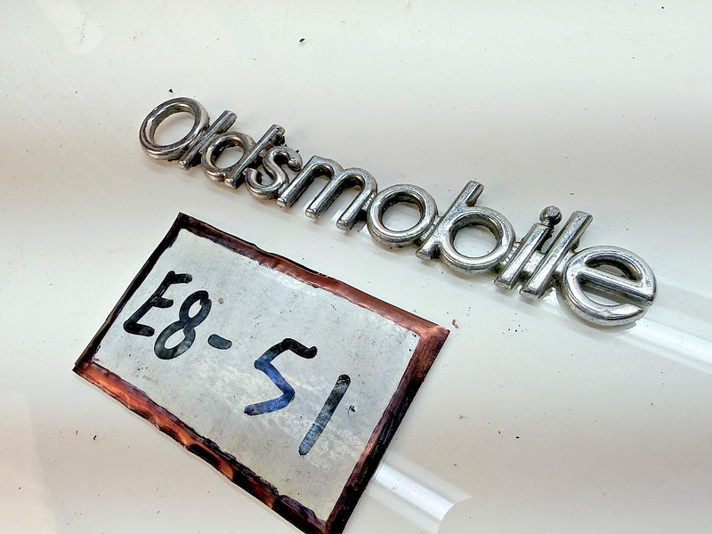 OEM 1987 1988 CUTLASS SUPREME 442 BROUGHAM HEADER PANEL SCRIPT Emblem E8-51